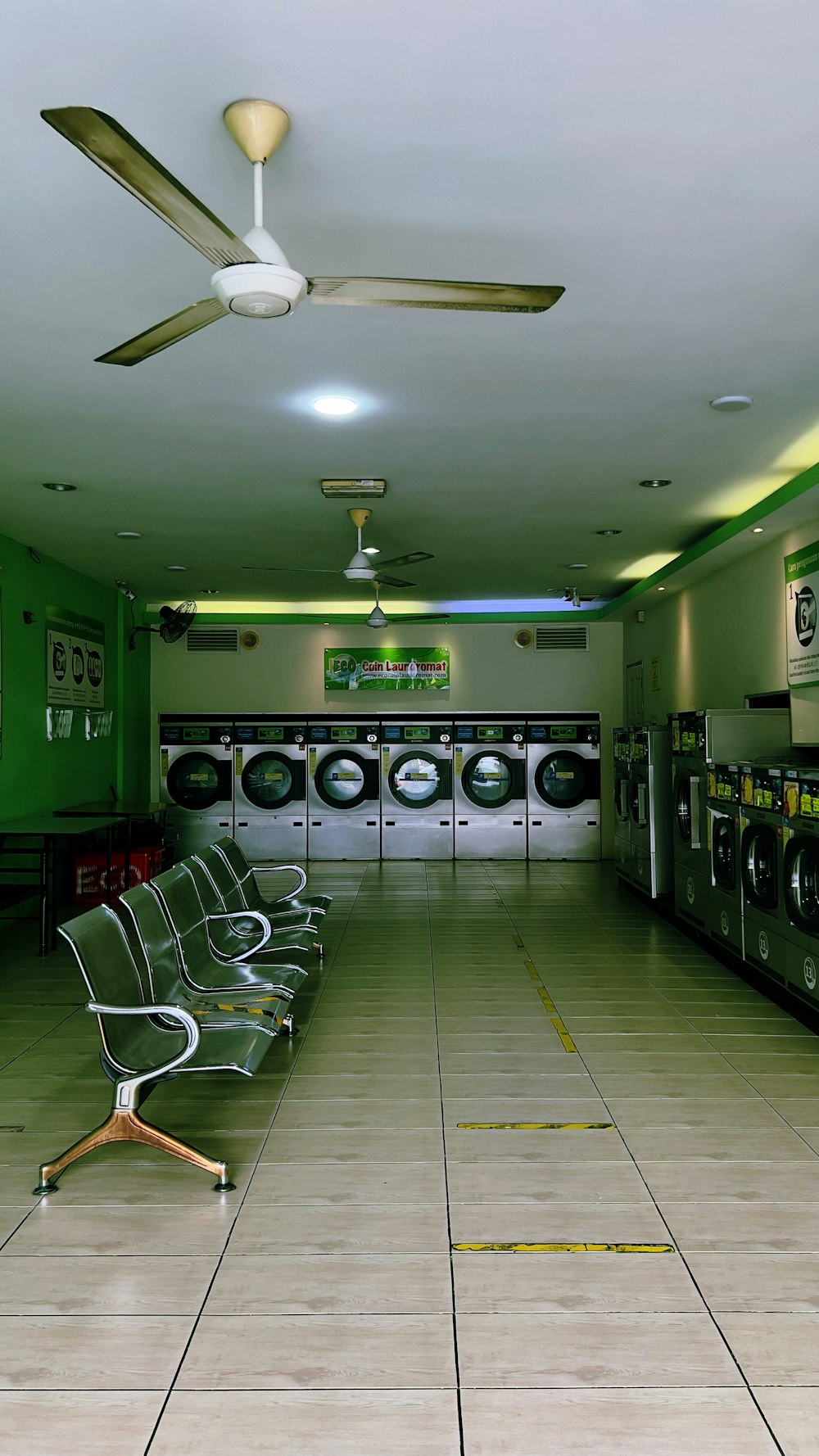 a room filled with lots of machines and chairs