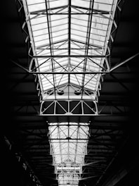 Photograph of a metal mezzanine floor inside an industrial building, showing structural supports.