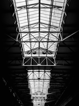 Photograph of a metal mezzanine floor inside an industrial building, showing structural supports.
