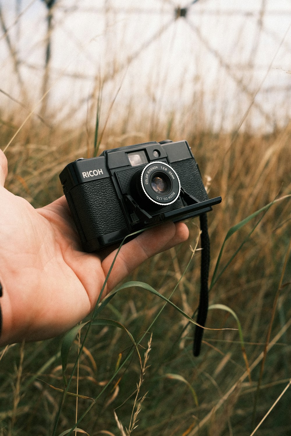 a person holding a camera in their hand