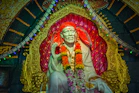 a statue of a man with a red headdress
