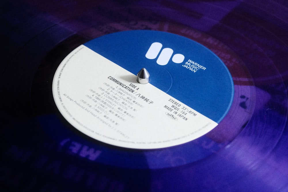 a blue record with a white label on it