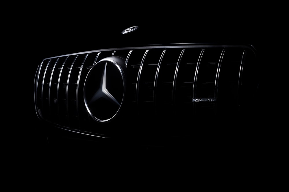 a close up of a mercedes logo on a car