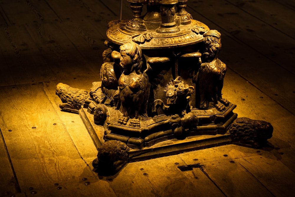 a wooden floor with a statue on top of it