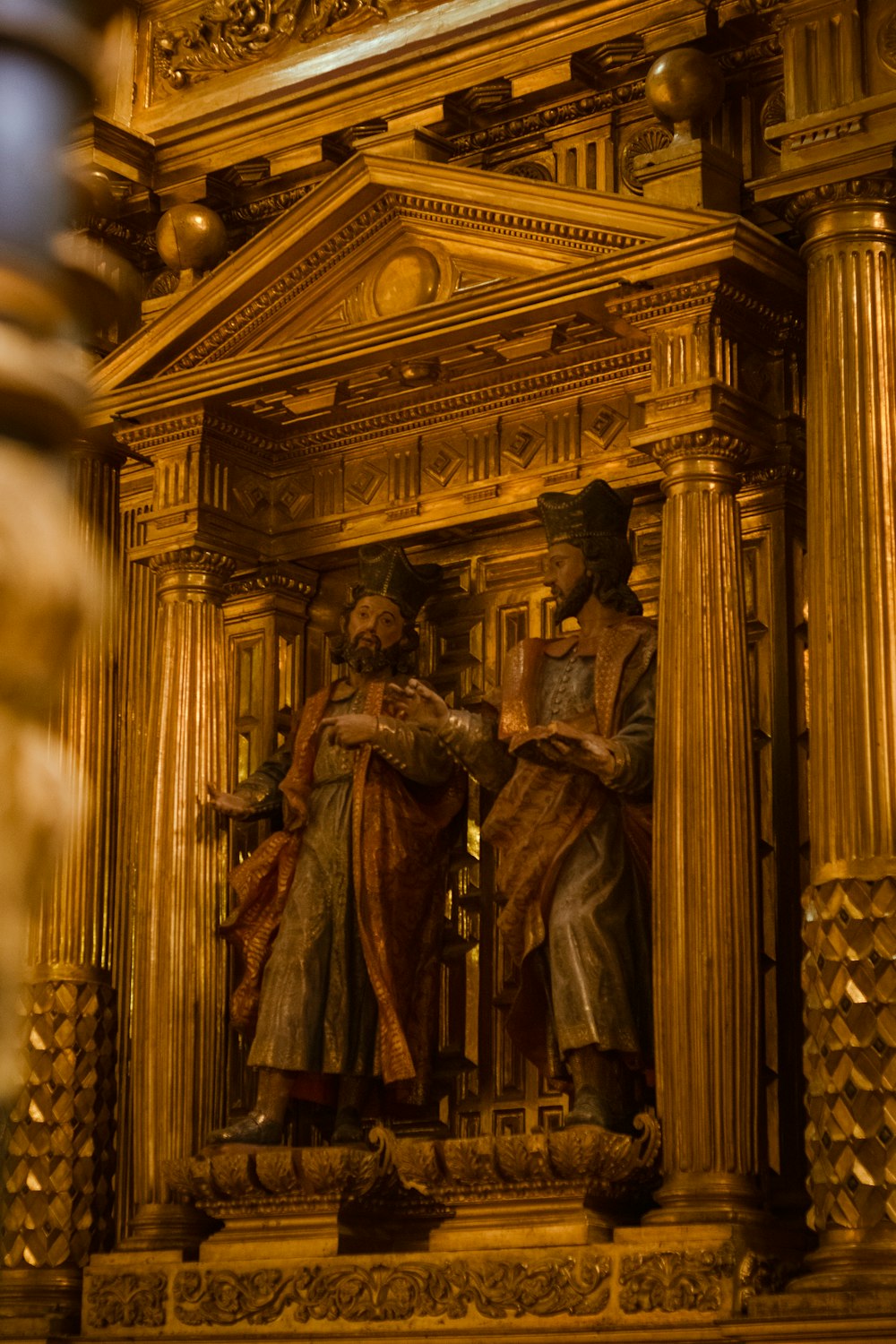 a statue of two men standing next to each other