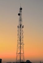 A scenic photo of Keith’s antenna tower standing tall against a sunset backdrop.