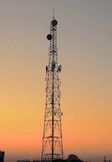 A scenic photo of Keith’s antenna tower standing tall against a sunset backdrop.