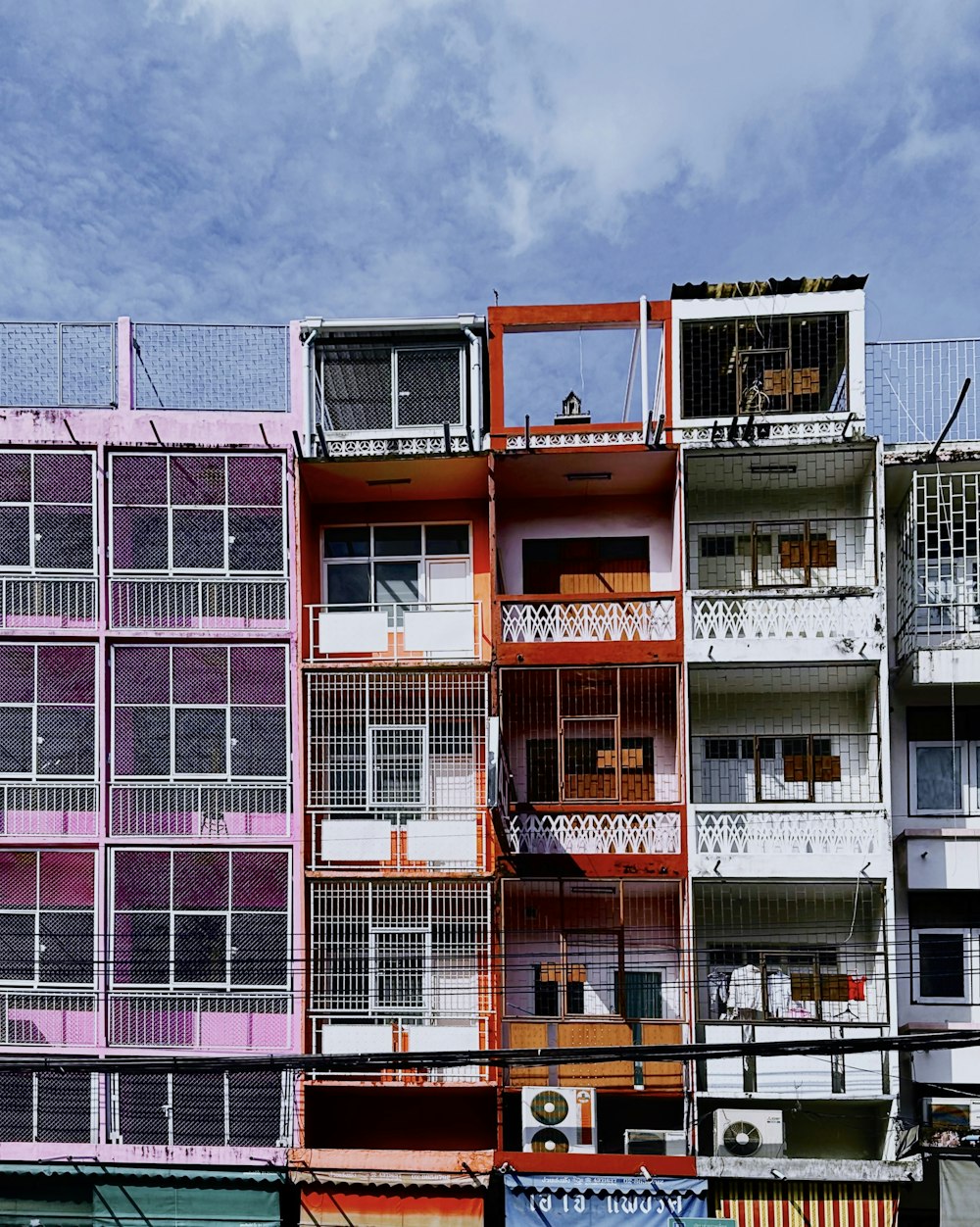 a tall building with balconies and balconies on top of it