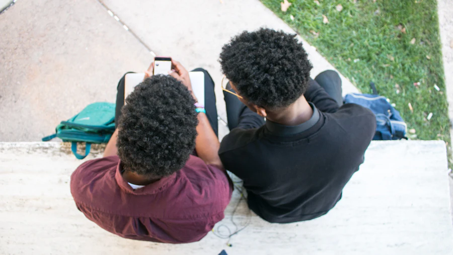 Two young people sitting together on a bench