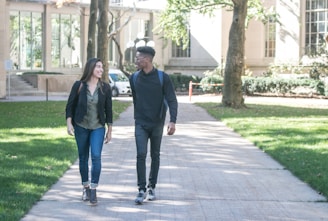 A university campus with students walking and engaging in conversations.