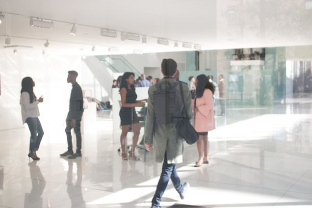 a group of people standing around in a building