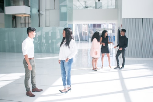 Stonegate Acquisitions team members discussing a property deal in a modern office setting