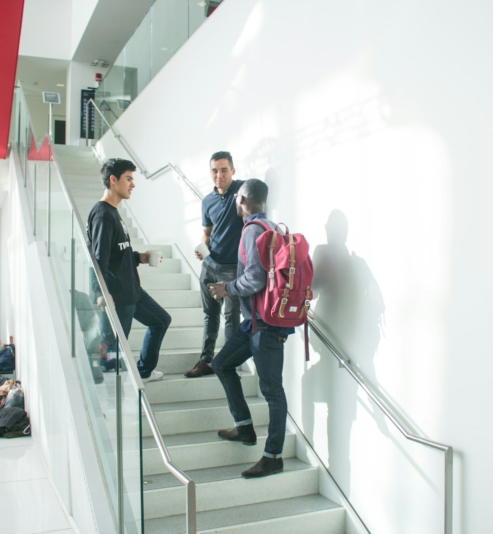 a group of young men walking down a flight of stairs