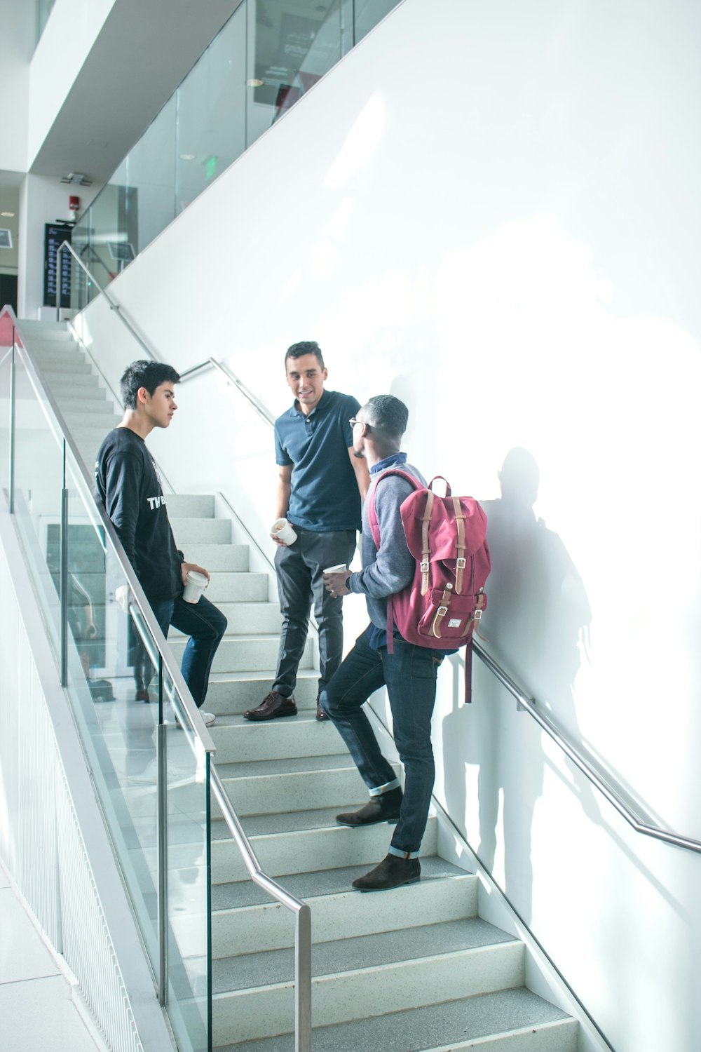 a group of people walking down a flight of stairs