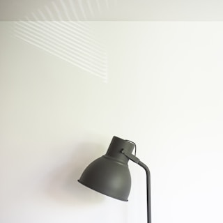 A modern LED wall lamp with a sleek design in a living room.