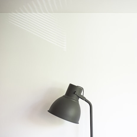 A modern LED wall lamp with a sleek design in a living room.