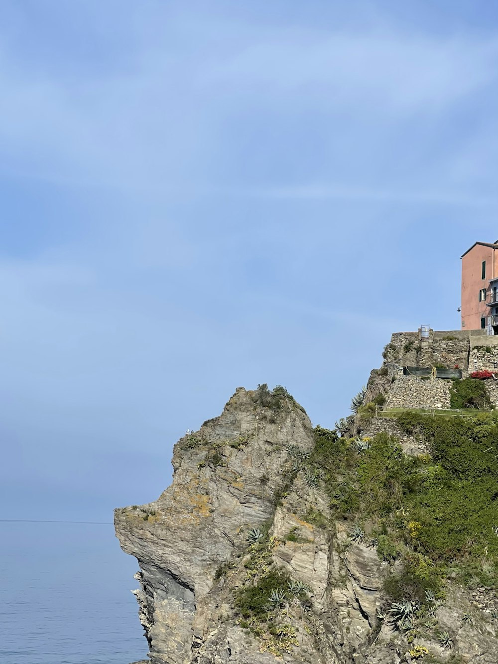 a house on a cliff overlooking the ocean