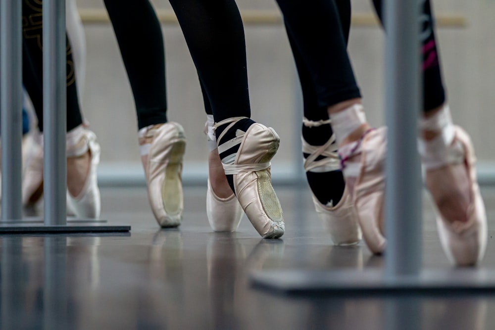 a group of ballet shoes lined up in a row