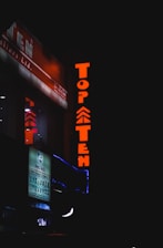 A sleek dark-themed website interface showing a top 10 online casinos list with neon green and gold highlights.