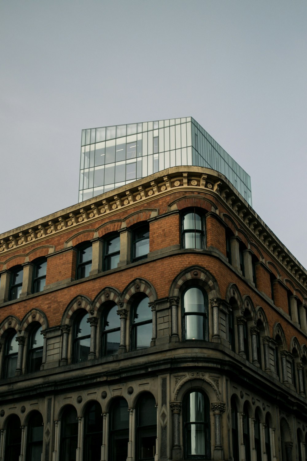 a tall brick building with a sky background