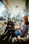 Couple enjoying a quiet moment on the cottage porch