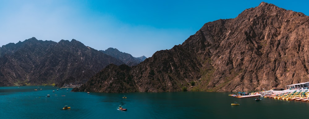 a group of boats floating on top of a lake