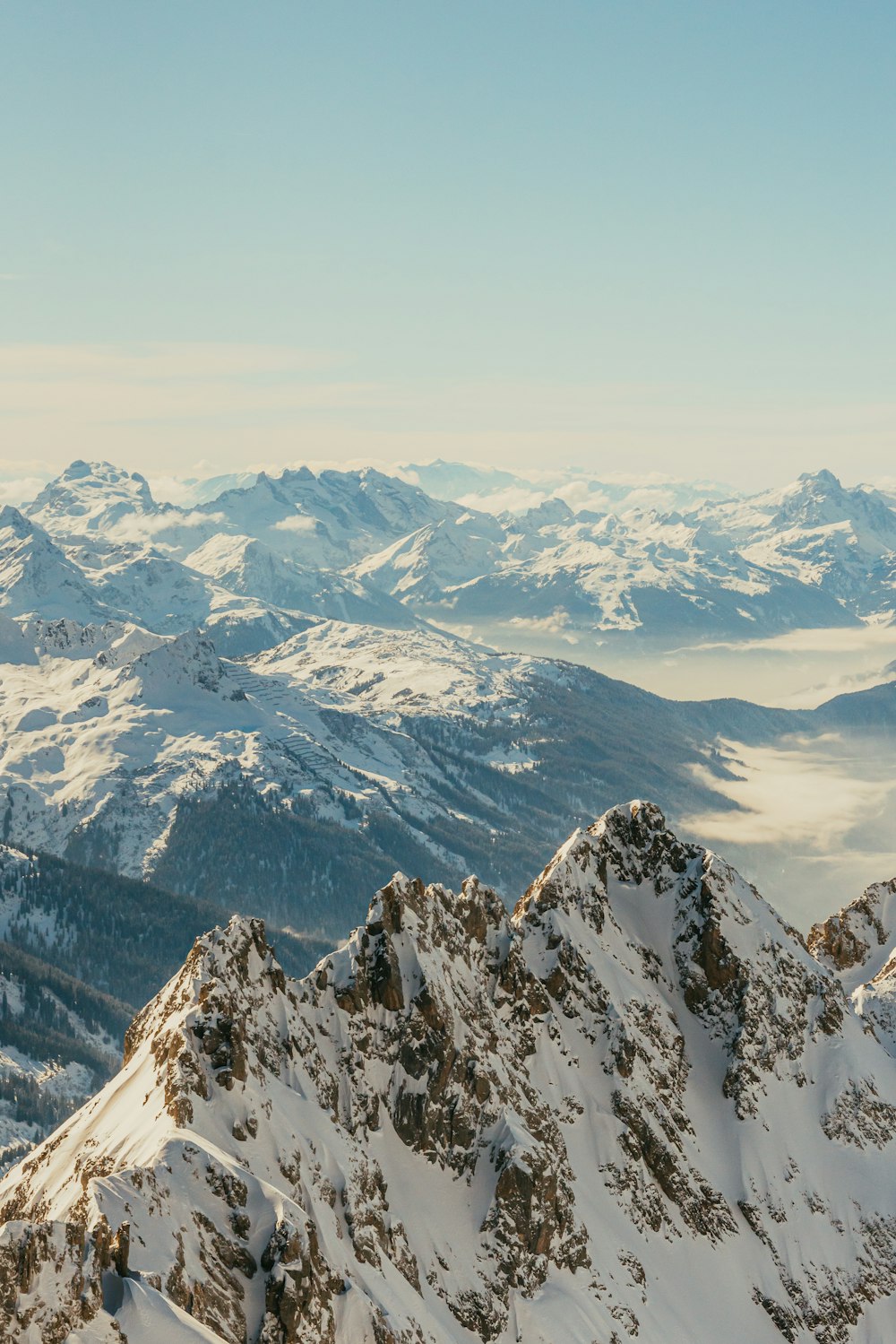 a view of a mountain range covered in snow