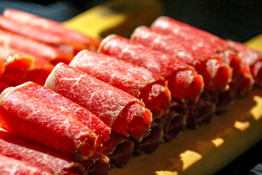 a close up of a bunch of meat on a cutting board