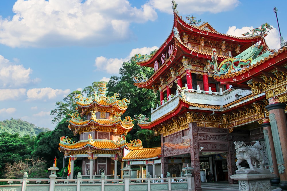 a chinese building with a statue in front of it