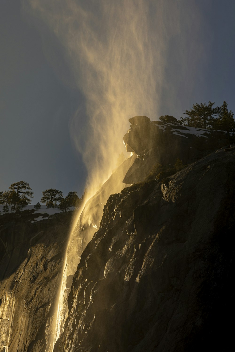 a sprinkle of water is coming out of a mountain