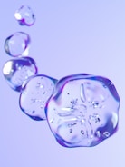 A glowing glassmorphic portfolio homepage with fluid animations under soft dark mode lighting.