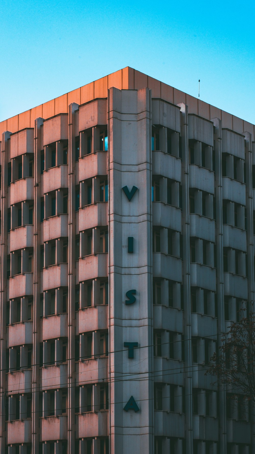 a tall building with a clock on the side of it