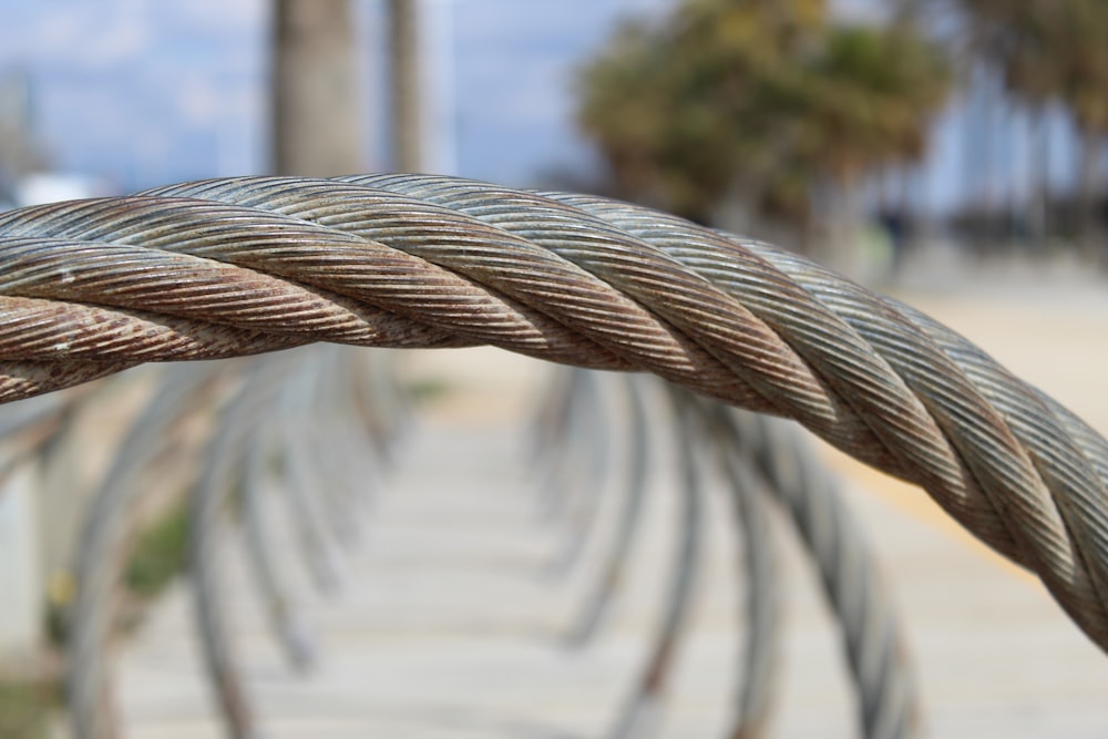 a close up of a rope on a sidewalk