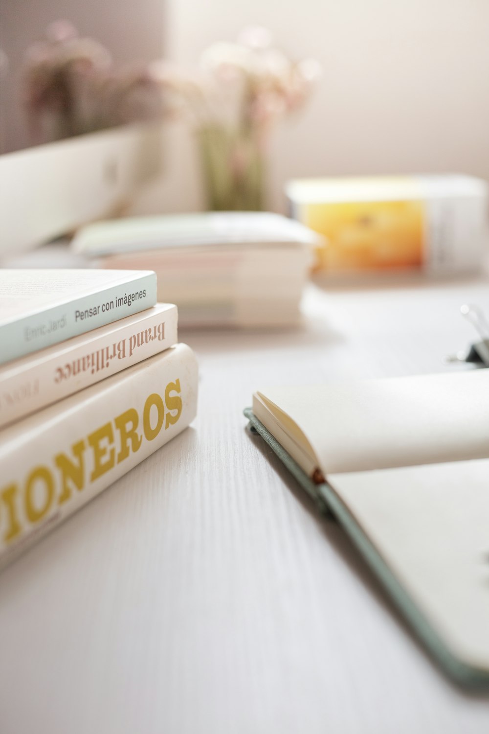 a stack of books sitting on top of a table