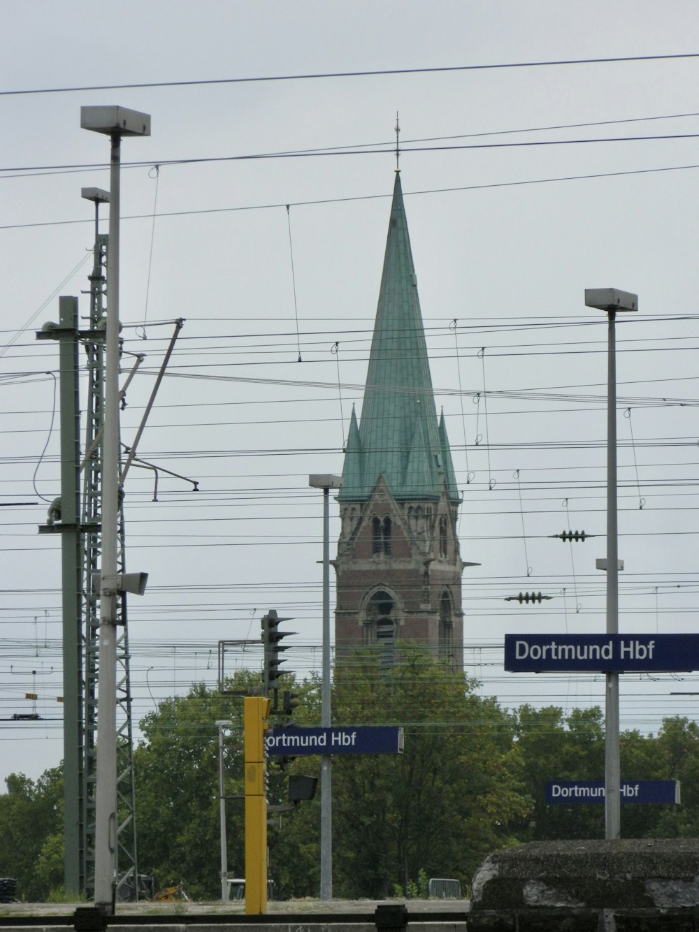 a tall clock tower towering over a city