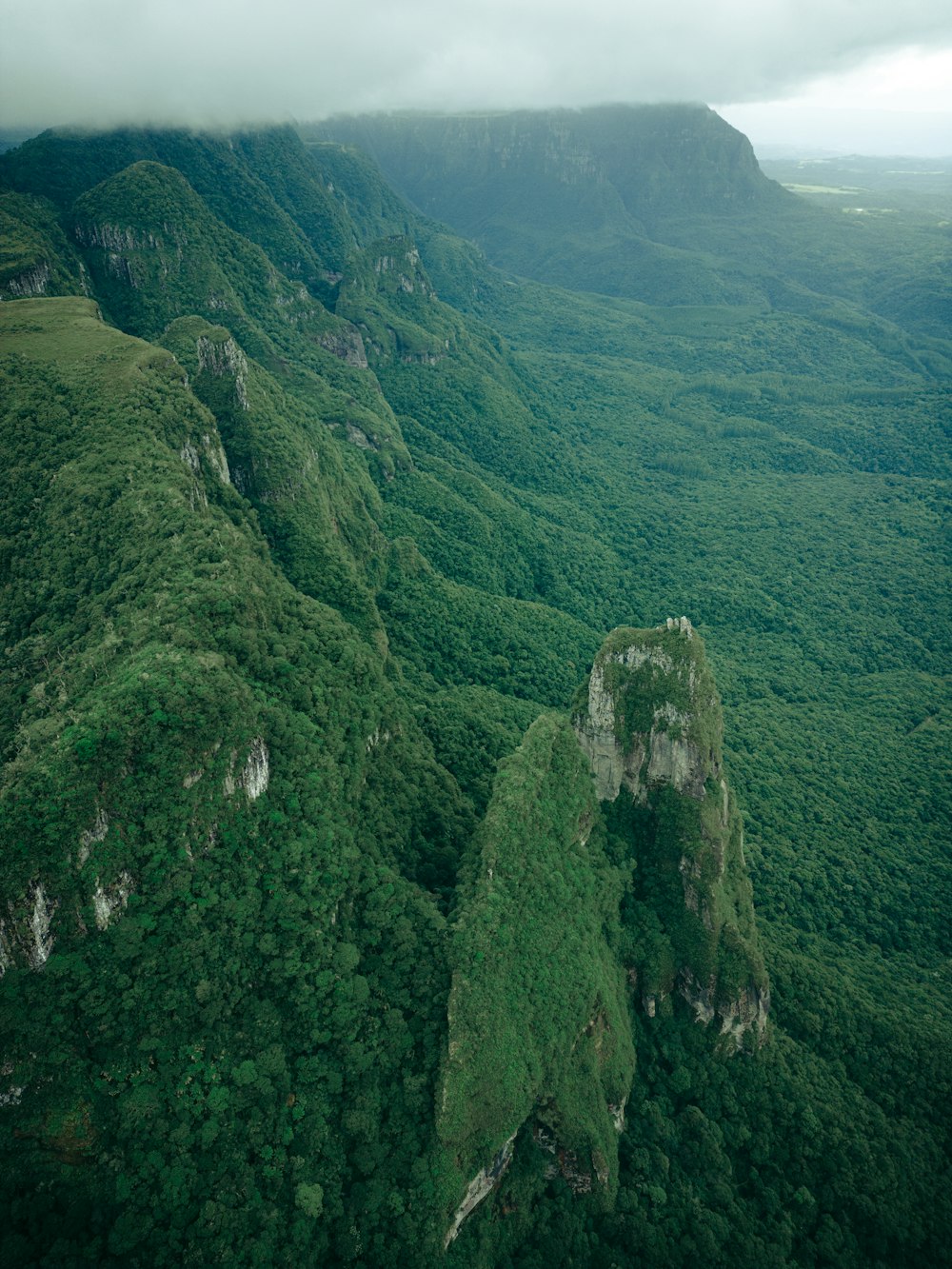 an aerial view of a lush green valley