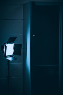 A sharp, sealed communication form illuminated by a single focused light in a dark room.