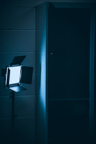 A sharp, sealed communication form illuminated by a single focused light in a dark room.