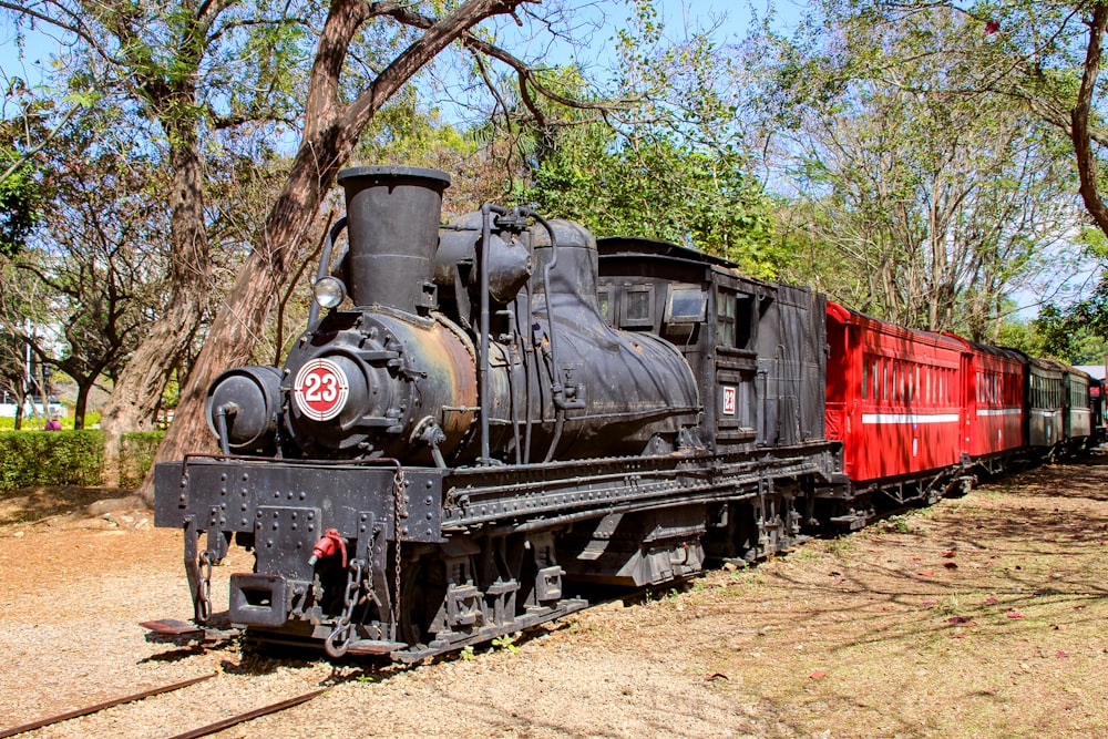 an old train is sitting on the tracks