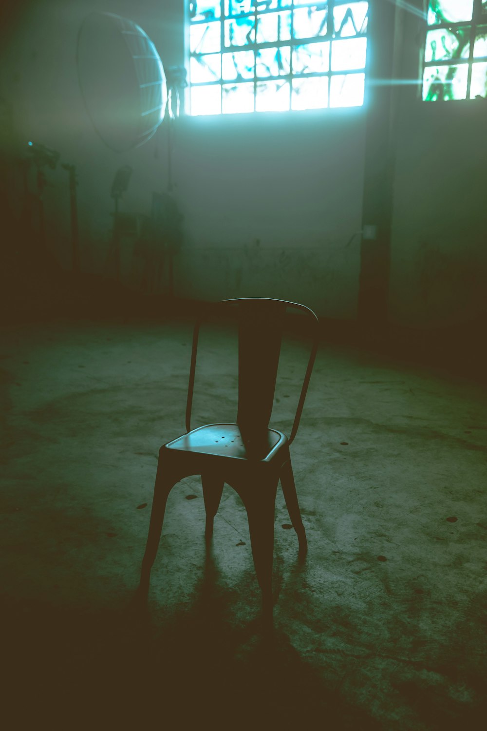 a chair sitting in the middle of a room