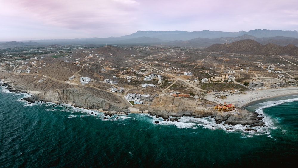 a bird's eye view of a small town on the coast