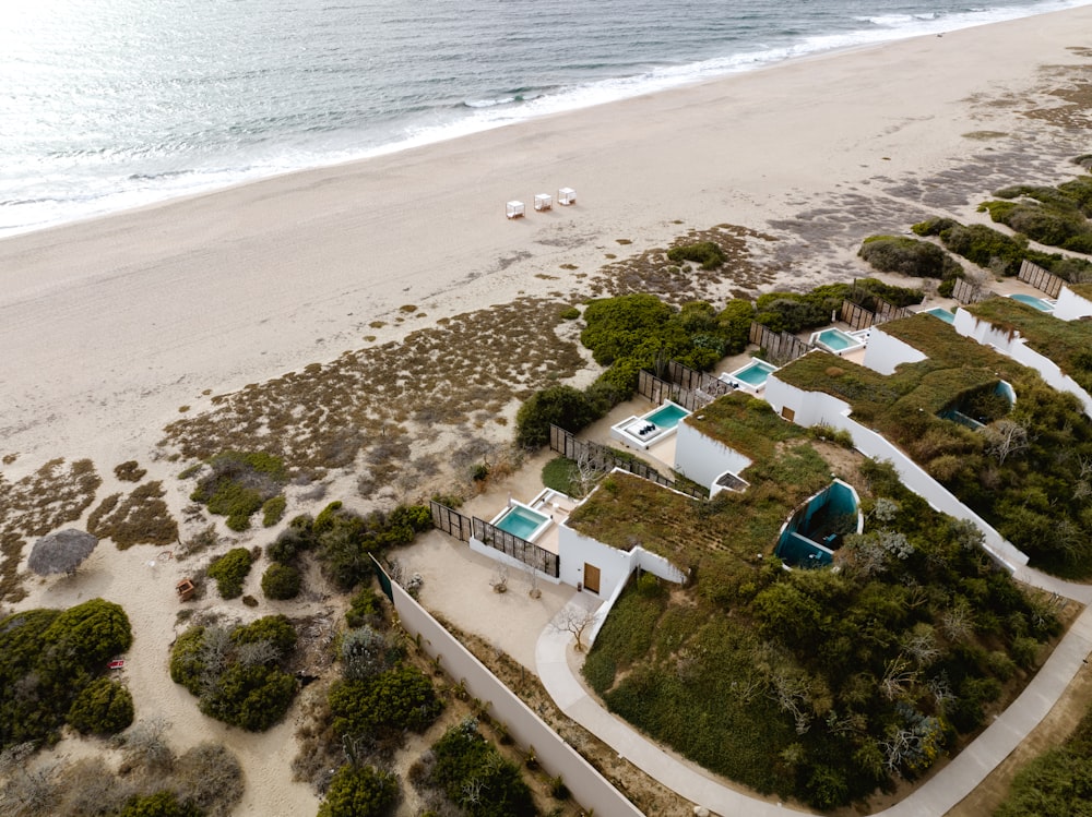 a bird's eye view of a sandy beach and ocean