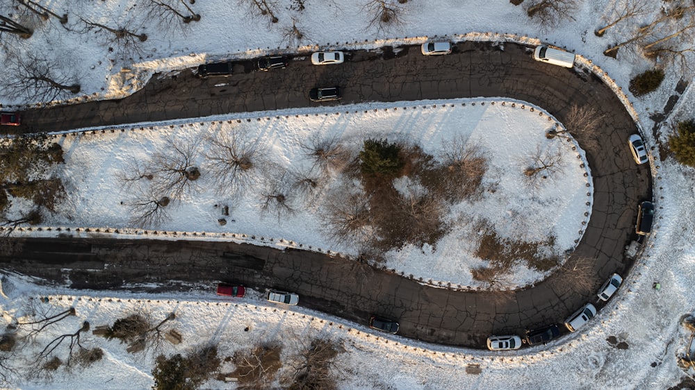 an aerial view of a snow covered road