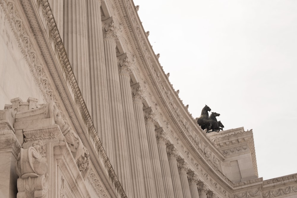 a statue of a horse on top of a building