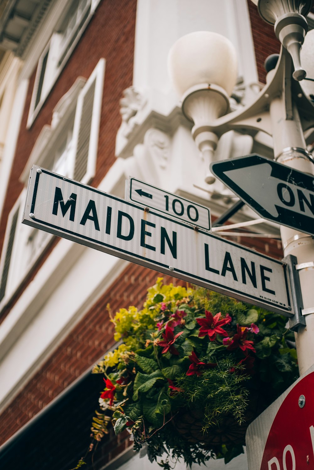 a close up of a street sign with a building in the background