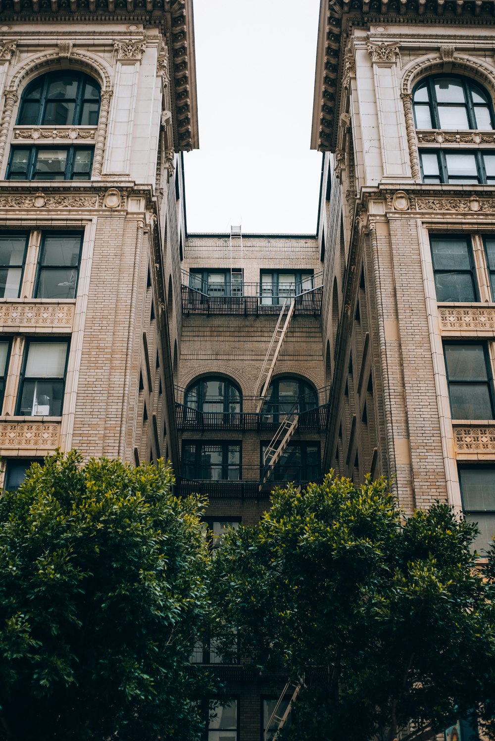 a tall building with two balconies on top of it