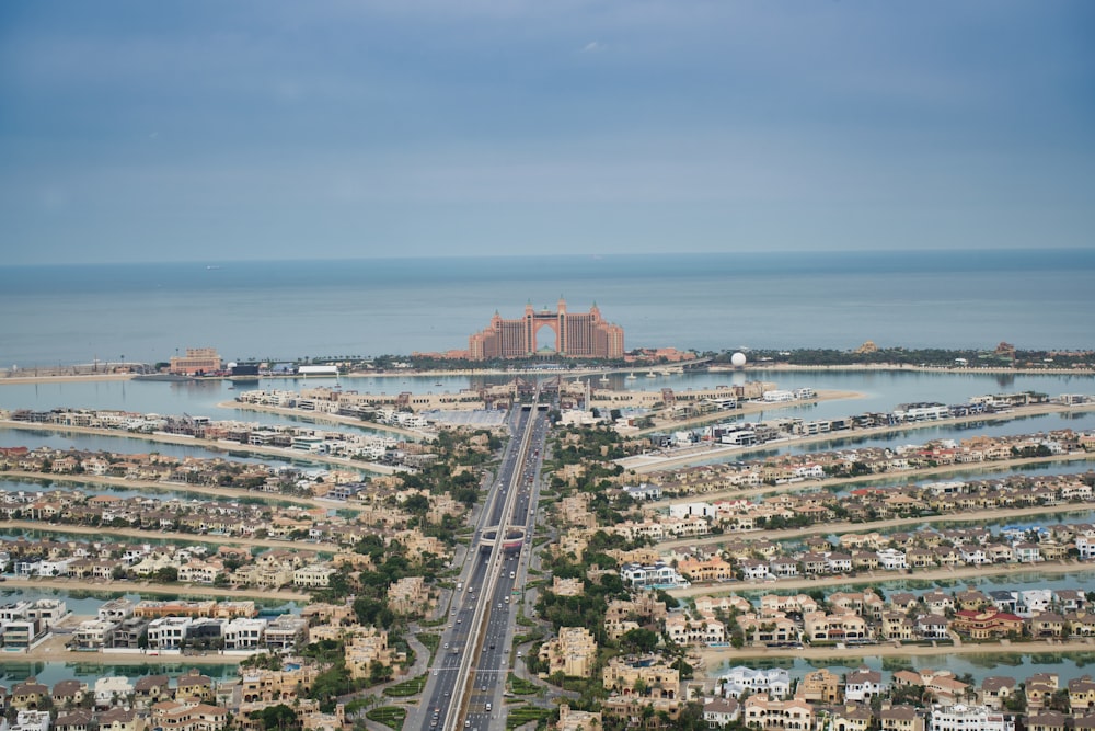 an aerial view of a city and a body of water