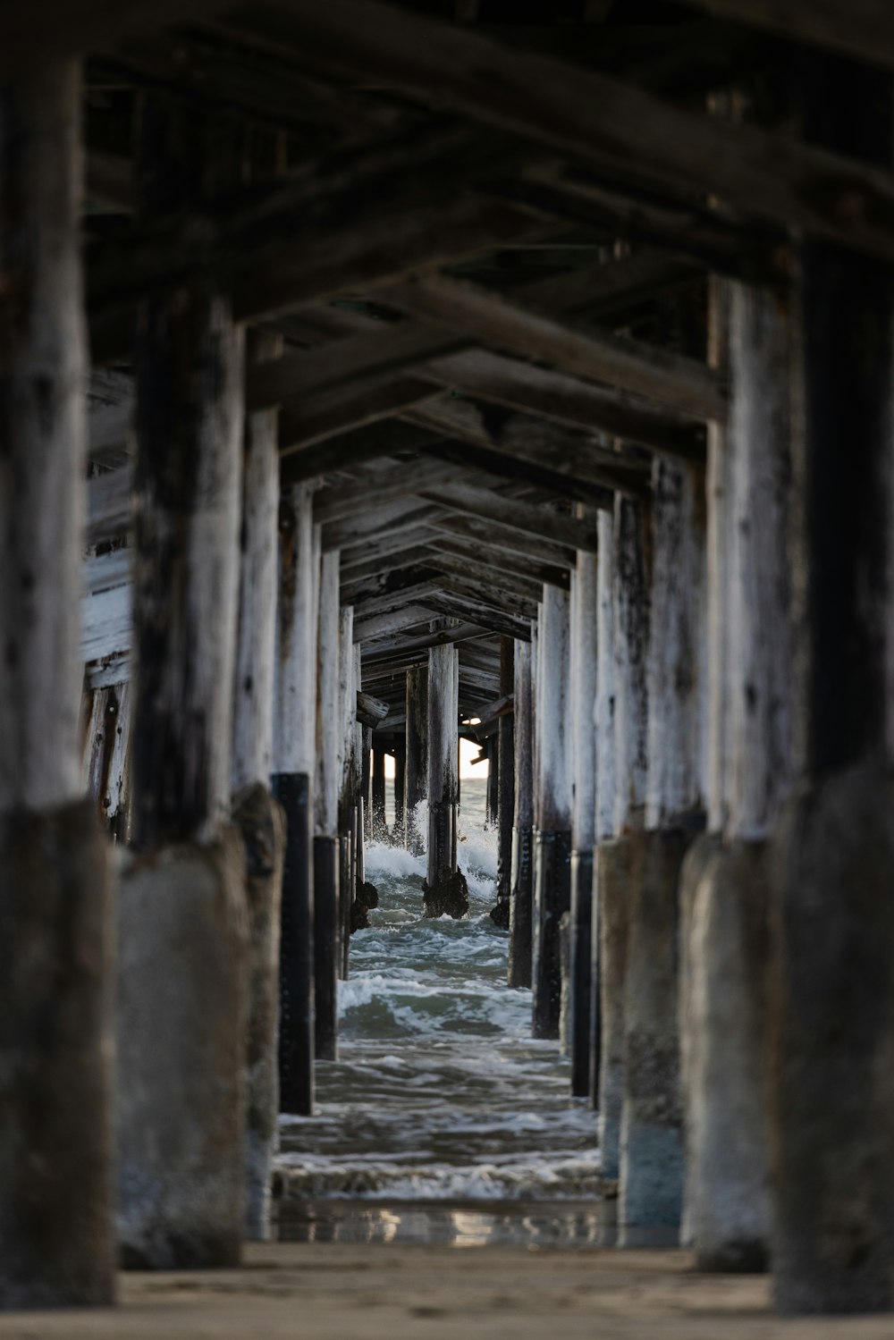 a view of the underside of a wooden pier