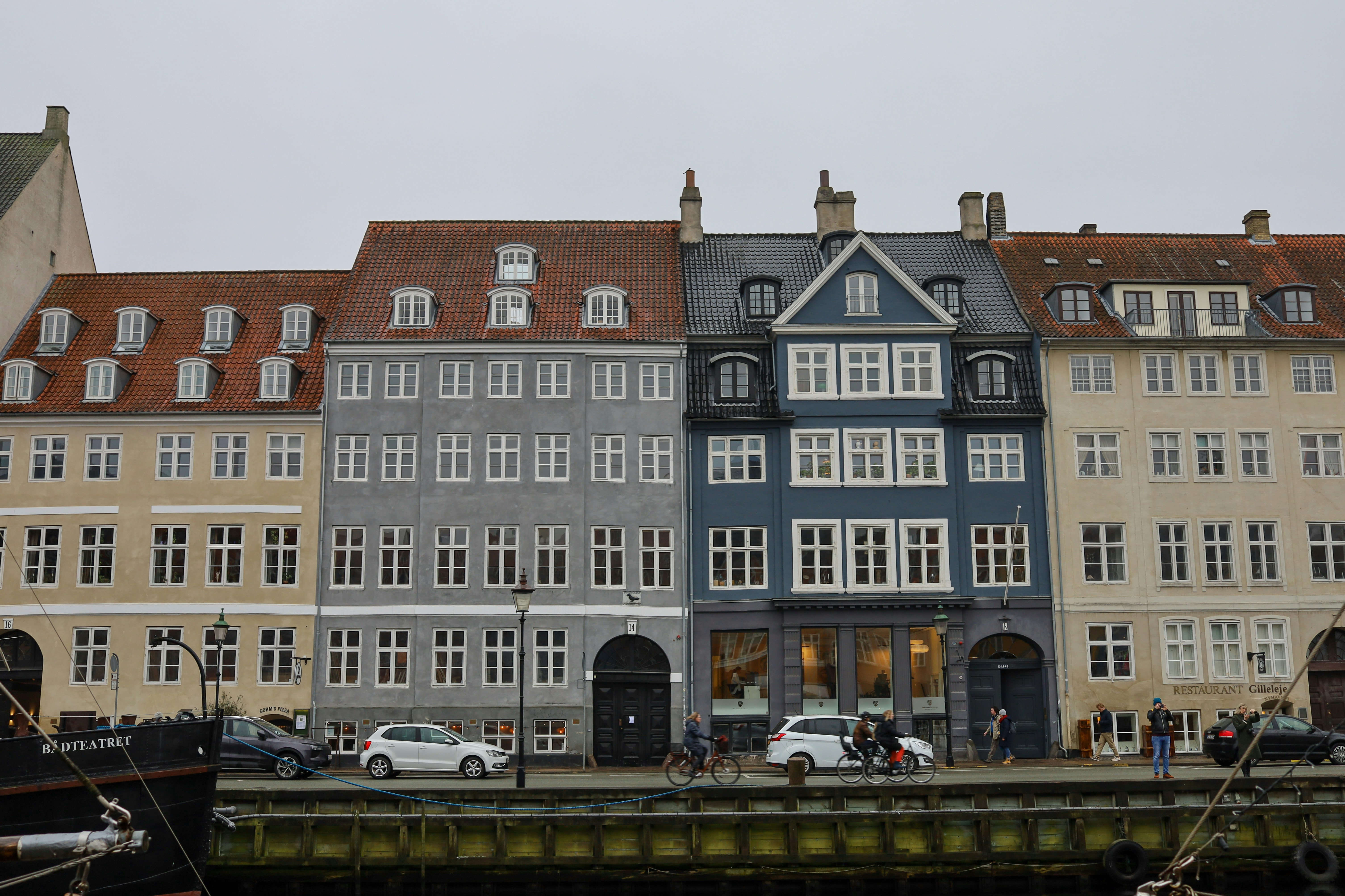a row of buildings next to a body of water