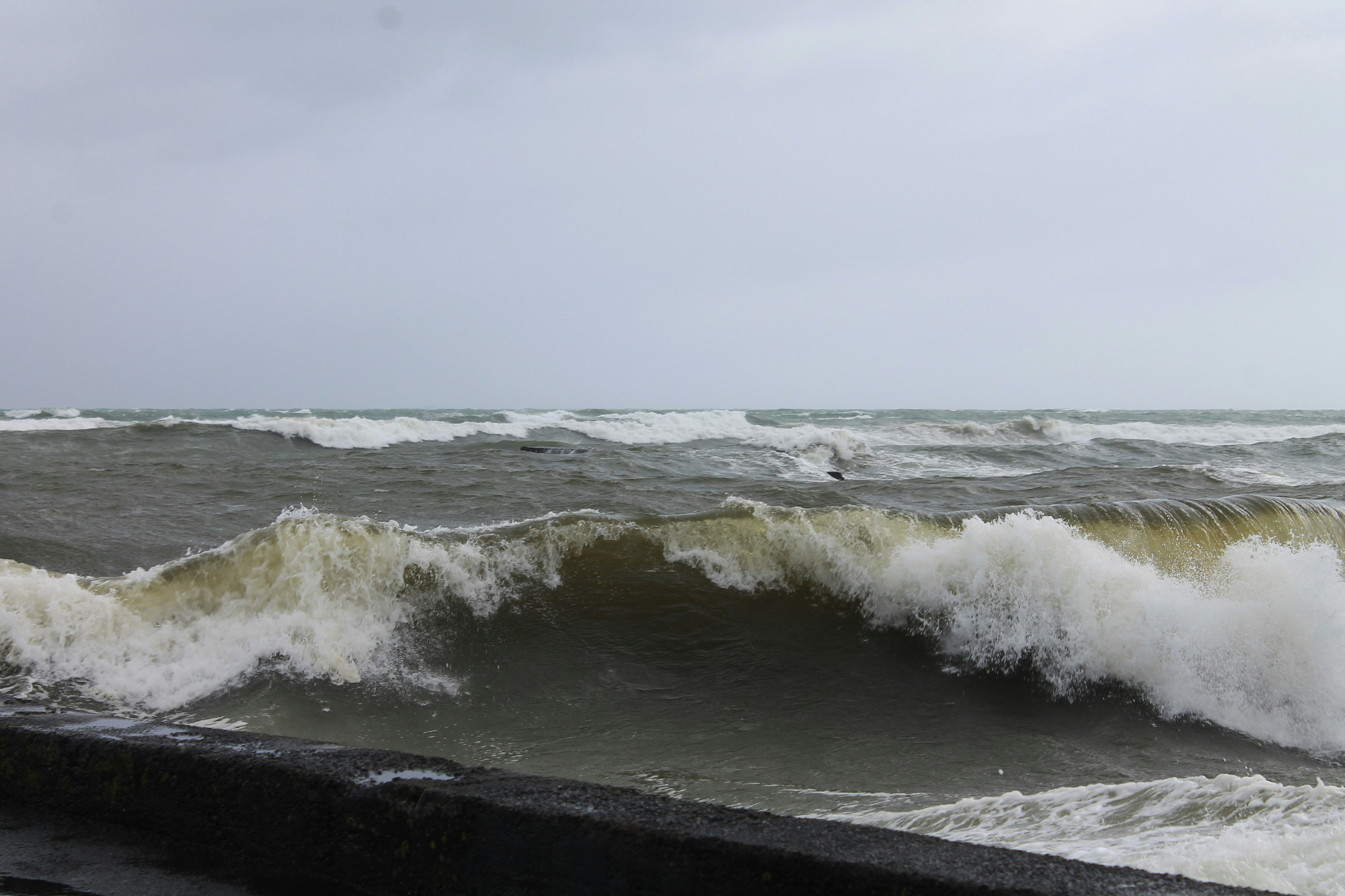 a person riding a surfboard on a wave in the ocean